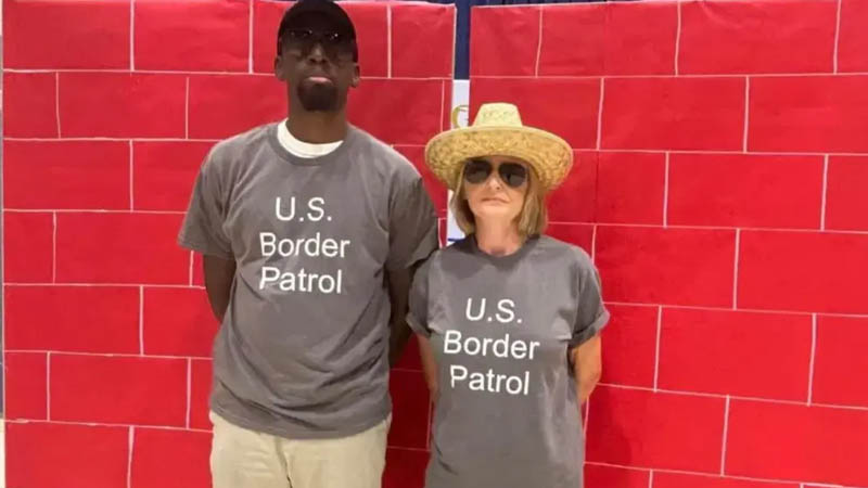 two staff members wearing “US Border Patrol” shirts